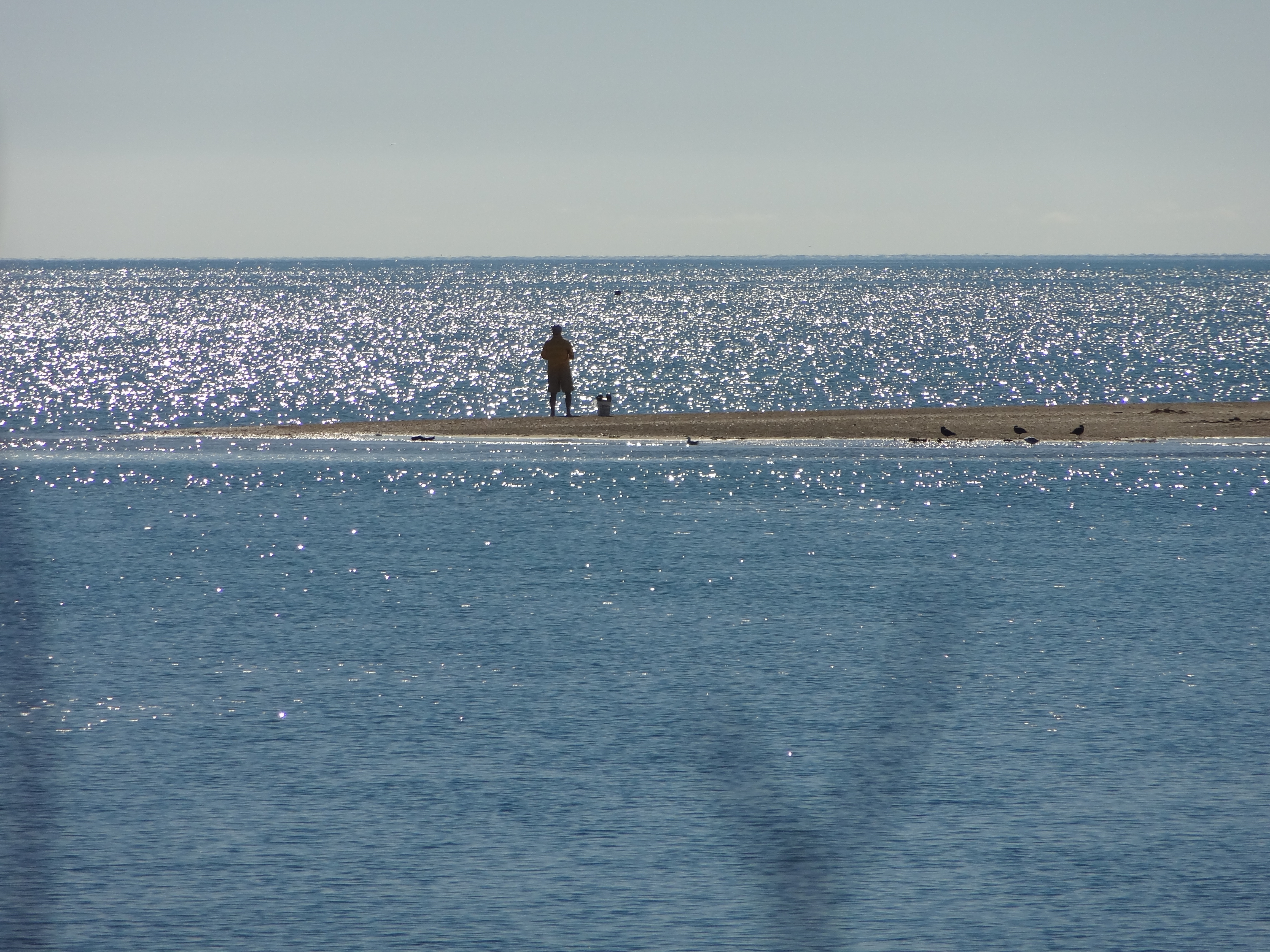 One man and his rod. It isn't difficult to find a beach to yourself here - this is Milnthorpe Quay 